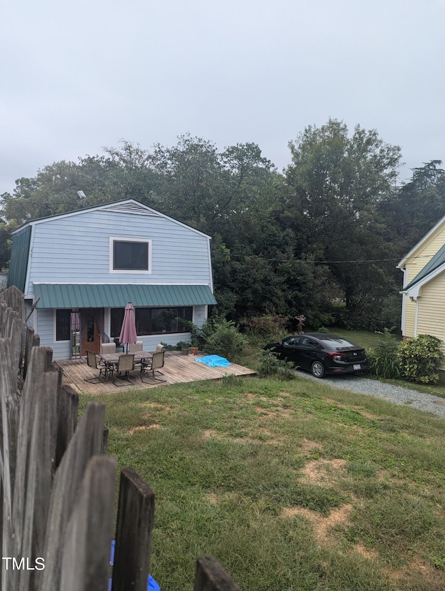 view of yard with fence and driveway