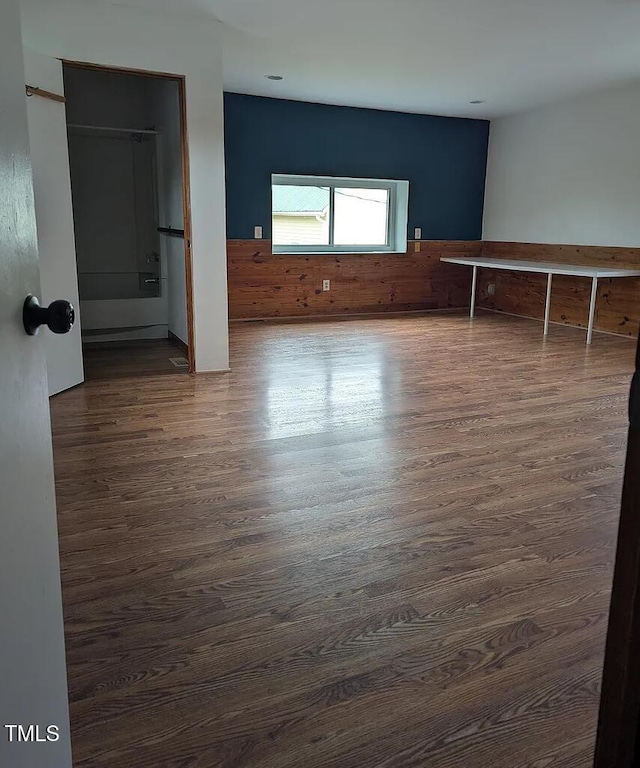 unfurnished bedroom featuring dark wood finished floors