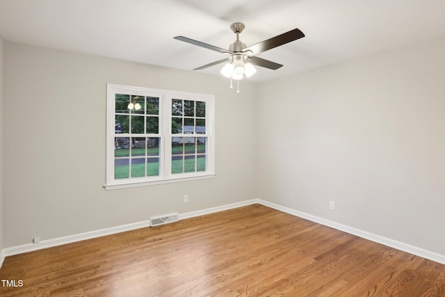 spare room featuring ceiling fan and light wood-type flooring