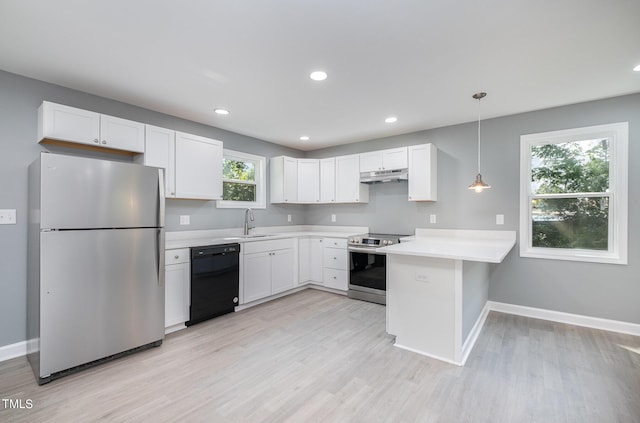 kitchen with white cabinetry, plenty of natural light, stainless steel appliances, and decorative light fixtures