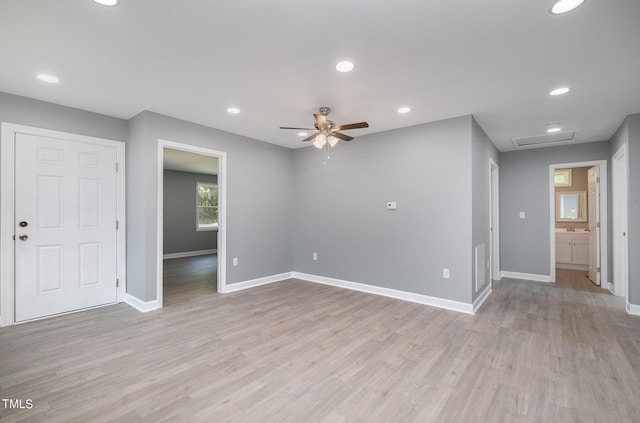 unfurnished room with light hardwood / wood-style flooring and ceiling fan