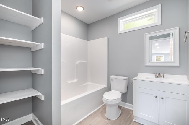 full bathroom with vanity, toilet, wood-type flooring, and shower / washtub combination