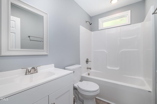 full bathroom with vanity, shower / bathtub combination, and toilet