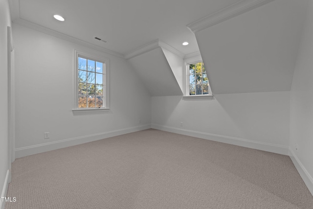 bonus room featuring recessed lighting, light colored carpet, visible vents, baseboards, and vaulted ceiling