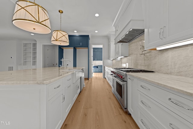 kitchen with white cabinetry, custom exhaust hood, and stainless steel appliances