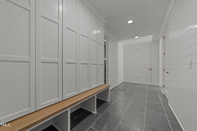 mudroom with recessed lighting and dark tile patterned flooring