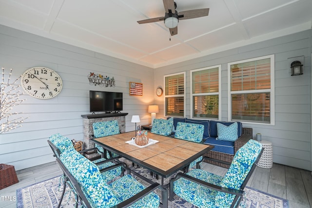 interior space featuring an outdoor living space and ceiling fan