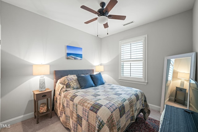 bedroom featuring light carpet and ceiling fan