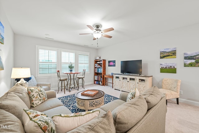 living room featuring ceiling fan and light carpet