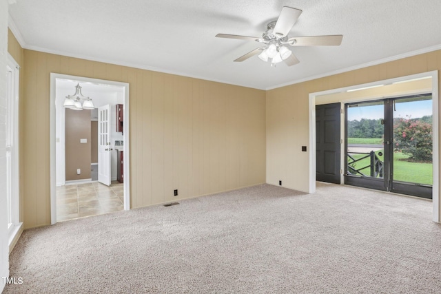 unfurnished room with ornamental molding, ceiling fan, and light carpet