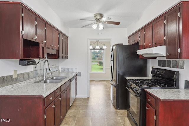 kitchen with stainless steel dishwasher, black range with gas stovetop, ceiling fan, and sink