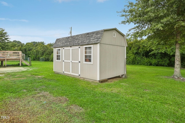 view of outdoor structure featuring a yard