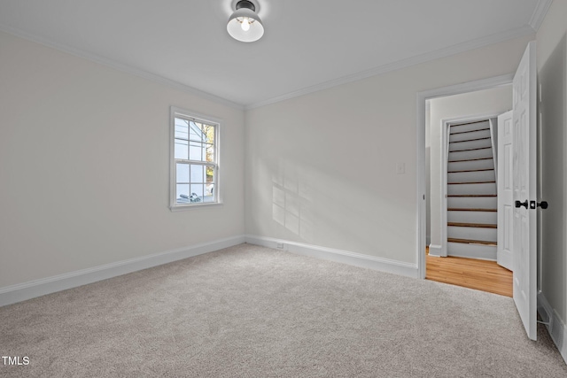 unfurnished bedroom featuring carpet and crown molding