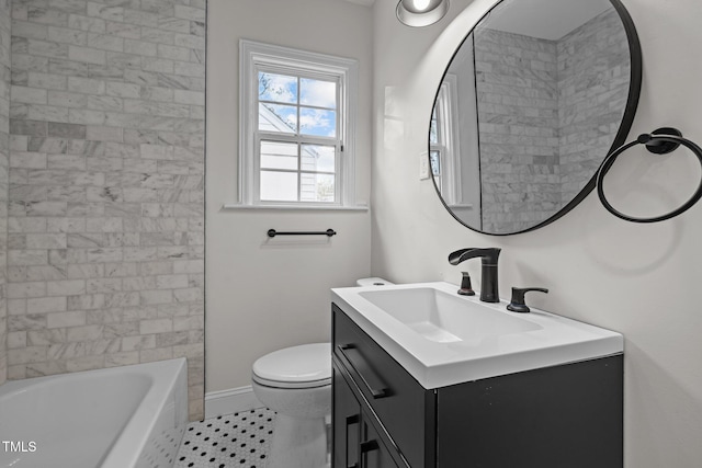 bathroom featuring vanity, tile patterned floors, and toilet