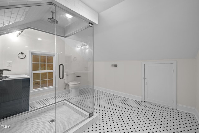 bathroom with toilet, an enclosed shower, and lofted ceiling