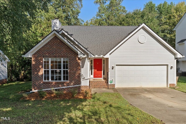 view of front of property featuring a front yard and a garage