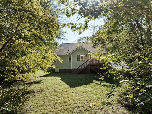 view of yard with a wooden deck