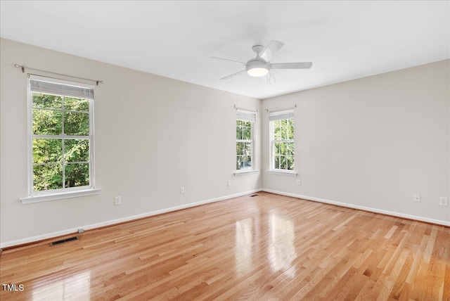 unfurnished room with light hardwood / wood-style flooring and ceiling fan