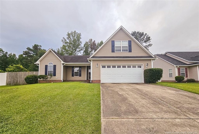 view of front of home with a garage and a front lawn