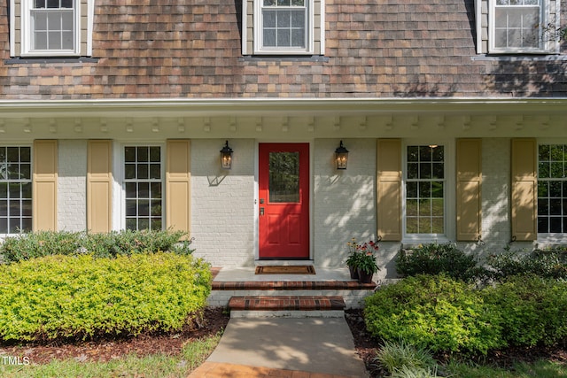 property entrance with covered porch