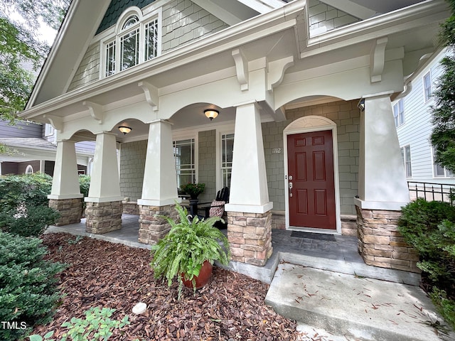 property entrance featuring covered porch