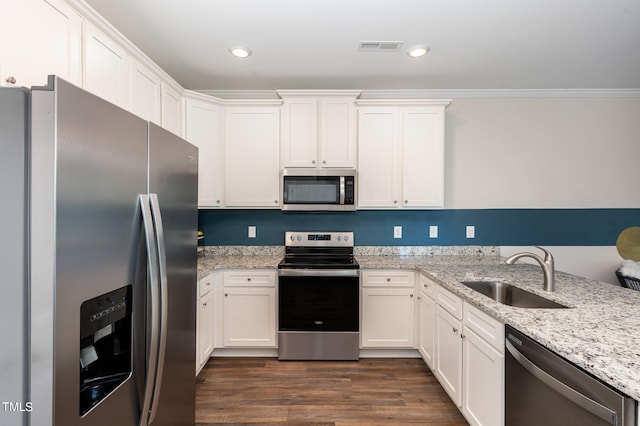 kitchen featuring white cabinets, light stone countertops, dark hardwood / wood-style flooring, stainless steel appliances, and sink