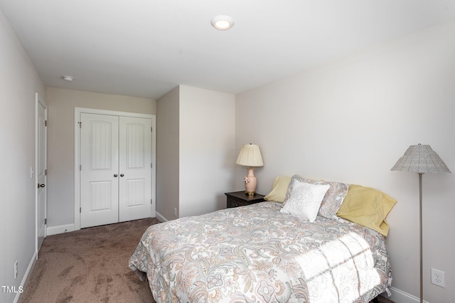 carpeted bedroom featuring a closet