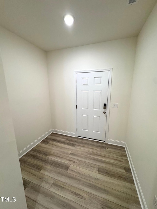 spare room featuring hardwood / wood-style floors