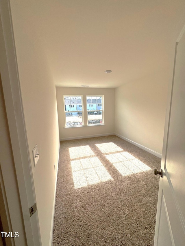 unfurnished room featuring carpet flooring