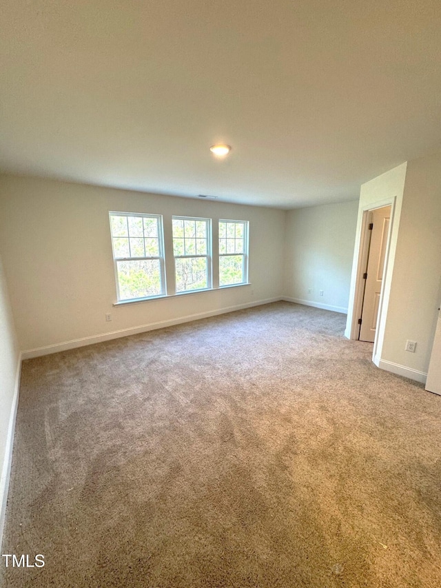 empty room with carpet flooring