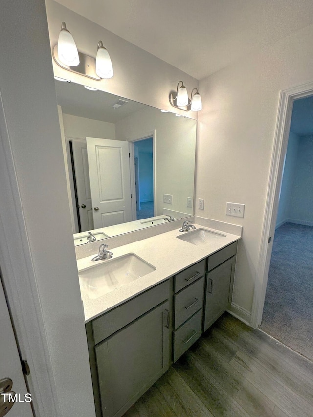 bathroom featuring hardwood / wood-style floors and vanity