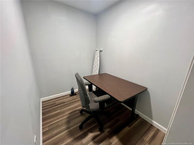 home office with wood-type flooring