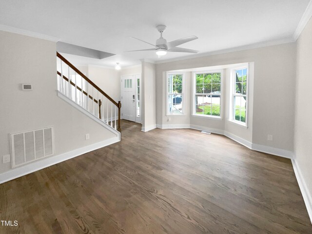 unfurnished living room with ceiling fan, dark hardwood / wood-style floors, and crown molding