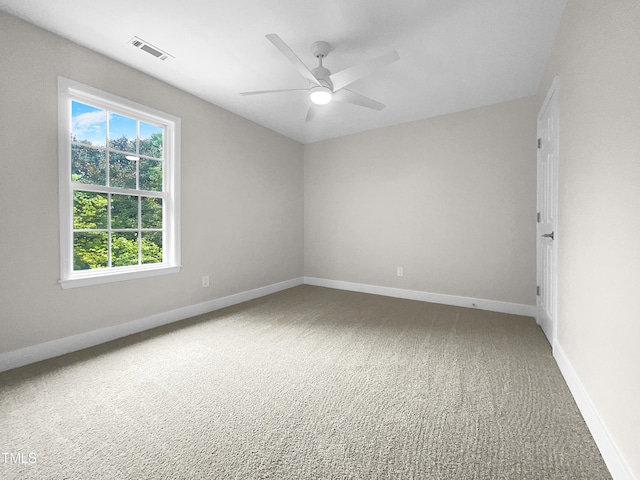 empty room featuring ceiling fan and carpet floors