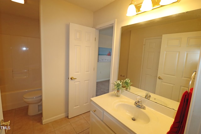 bathroom featuring tile patterned flooring, vanity, and toilet