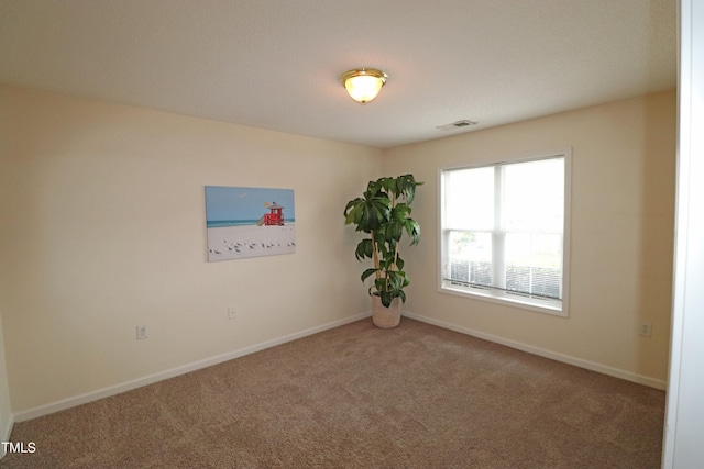 empty room with carpet flooring