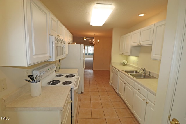 kitchen featuring white cabinetry, sink, an inviting chandelier, white appliances, and light tile patterned flooring