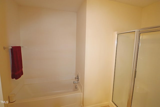 bathroom with shower with separate bathtub