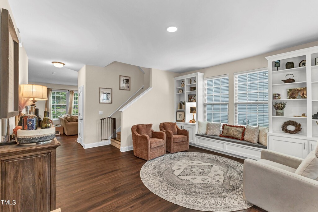 living room featuring radiator and dark hardwood / wood-style flooring