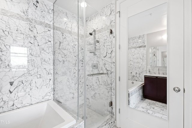 bathroom with vanity and separate shower and tub