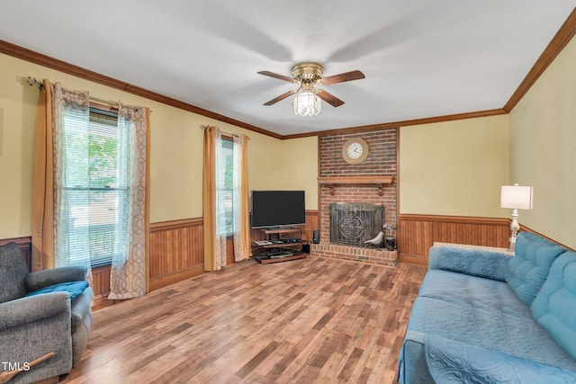 living room with hardwood / wood-style floors, ceiling fan, and a healthy amount of sunlight