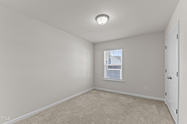 empty room featuring light colored carpet