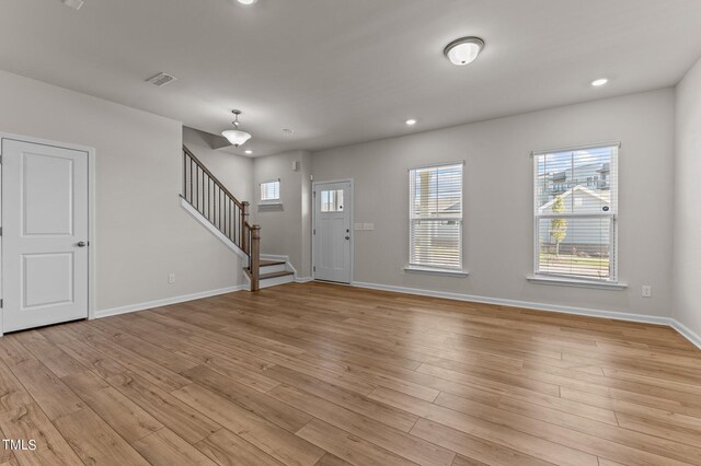 entrance foyer with light hardwood / wood-style flooring