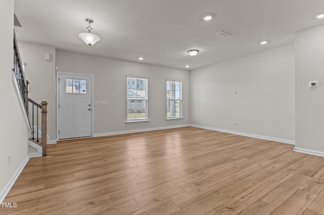 entrance foyer with light hardwood / wood-style flooring