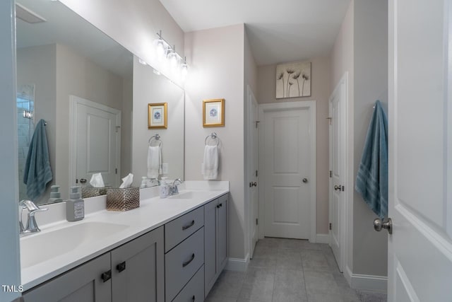 bathroom with tile patterned flooring and vanity