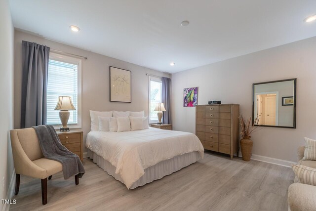 bedroom with light hardwood / wood-style flooring