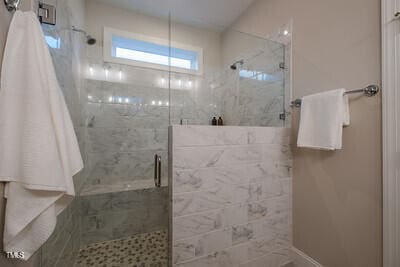 bathroom with a shower stall