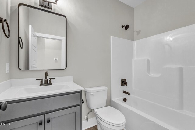 full bathroom featuring vanity, toilet, and shower / bathtub combination