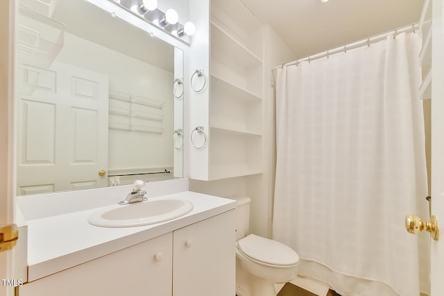 full bathroom with toilet, a shower with shower curtain, and vanity