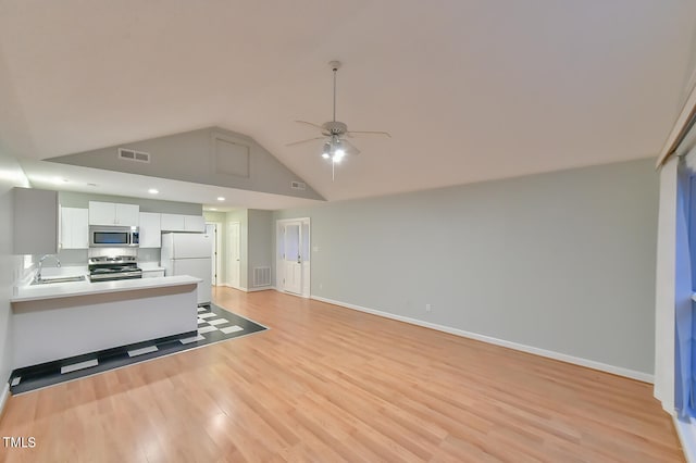 unfurnished living room with baseboards, light wood-style flooring, visible vents, and a ceiling fan